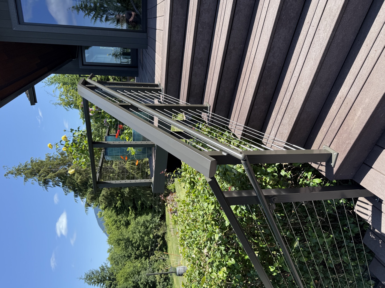 Composite deck stairs with cable railing and mountain view